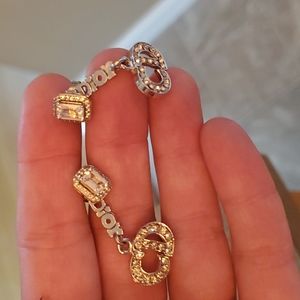 Dior dangle earrings with rhinestones on the dior logo